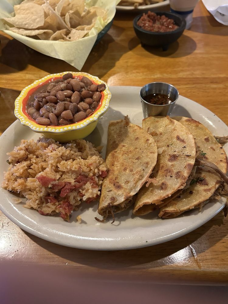 Three carne asada tacos with Mexican rice, pinto beans, and salsa &mdash; from the recently added taco cantina program