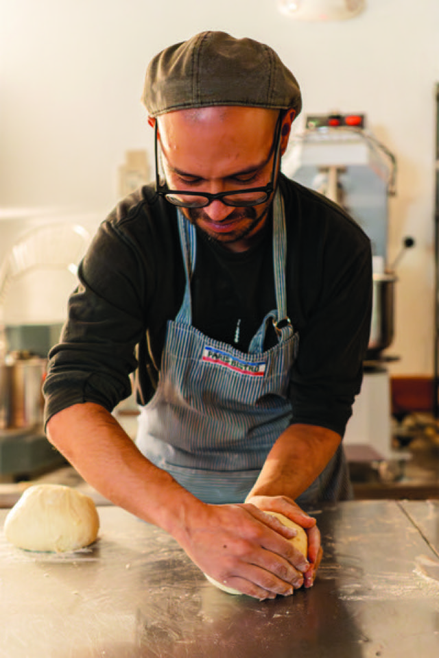 Interior view of the Levain It Up bakery counter with baked goods on display