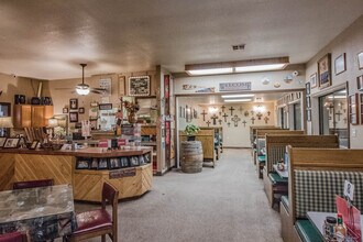Inside Big Daddy's Diner with Western decor, booths, and barrel accents