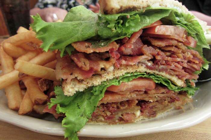 Stacked BLT sandwich with fries at Dusty Boots Cafe