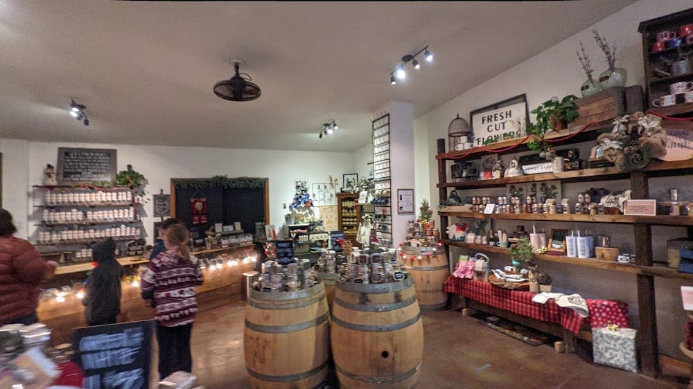 Inside Old Barrel Tea Company — barrels, shoppers browsing shelves of tea and gifts
