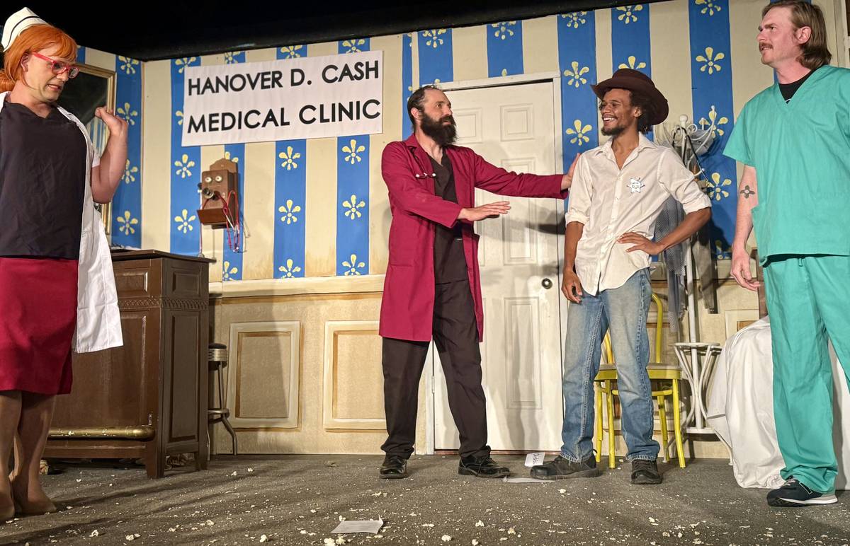 Four actors on stage in front of the Hanover D. Cash Medical Clinic set at a Cloudcroft Light Opera Company melodrama