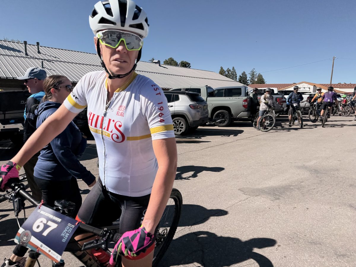 Rider #67 in a Hill’s Sport Shop jersey with High Altitude Classic race plate, other racers behind