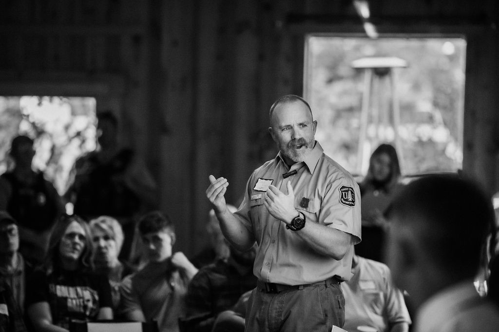 A Lincoln National Forest ranger speaking to visitors near Cloudcroft