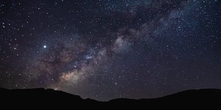 Milky Way arching over the Sacramento Mountains — dark-sky stargazing near Mayhill