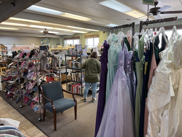 Formalwear section at King's Treasure with prom and quinceañera gowns in lavender, mint, sage, and ivory