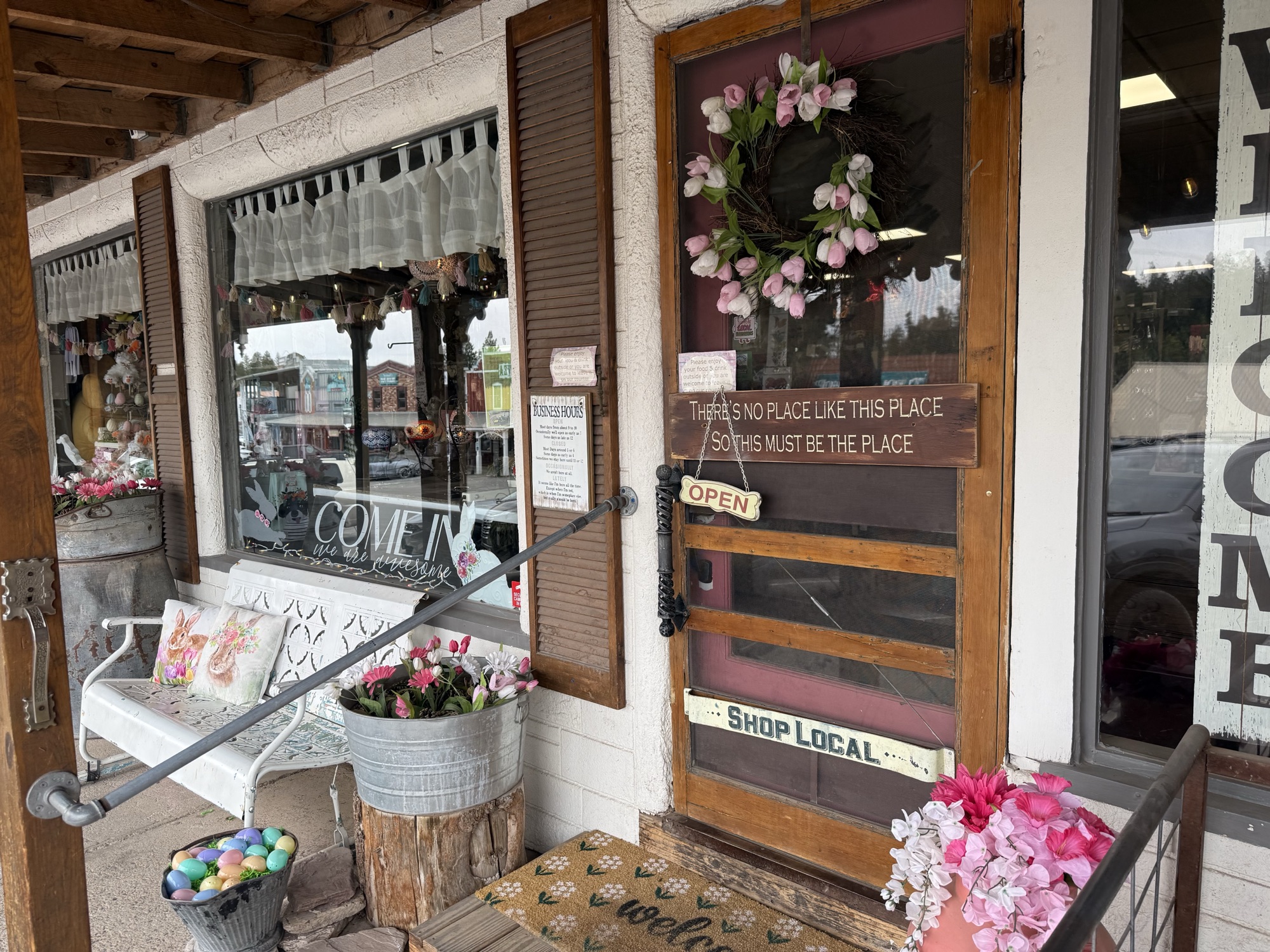 Mountain Magic storefront on Burro Avenue with the painted Biggest Little Store in Town sign and the 1969 Ford pickup parked out front