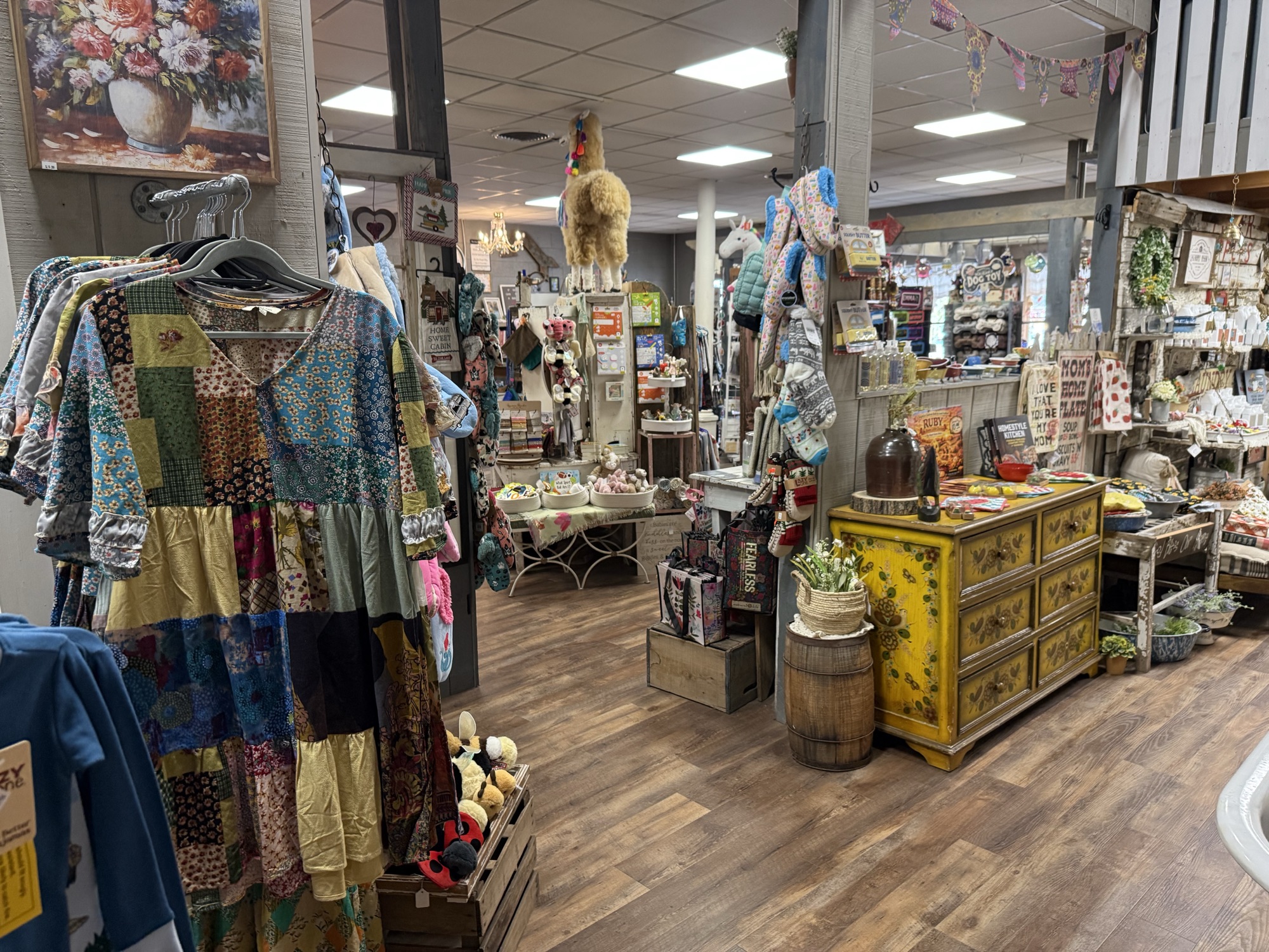 Candles, country home décor, and rugs filling the Mountain Magic shop floor