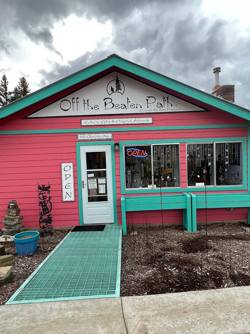 Off the Beaten Path — pink and turquoise storefront on Glorietta Ave