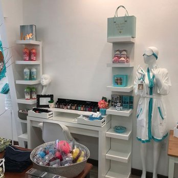 Beauty products and styled mannequin display at CoCo Blu