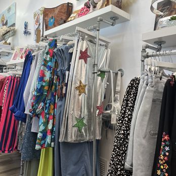 Clothing racks with colorful women's apparel at CoCo Blu