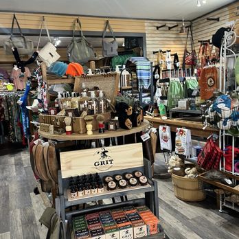 Interior of Poke The Bear showing display of candles, gifts, bags, and outdoor goods