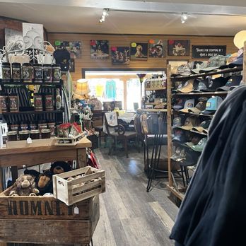 Interior of Poke The Bear showing hats, mugs, stuffed animals, and Bigfoot merchandise
