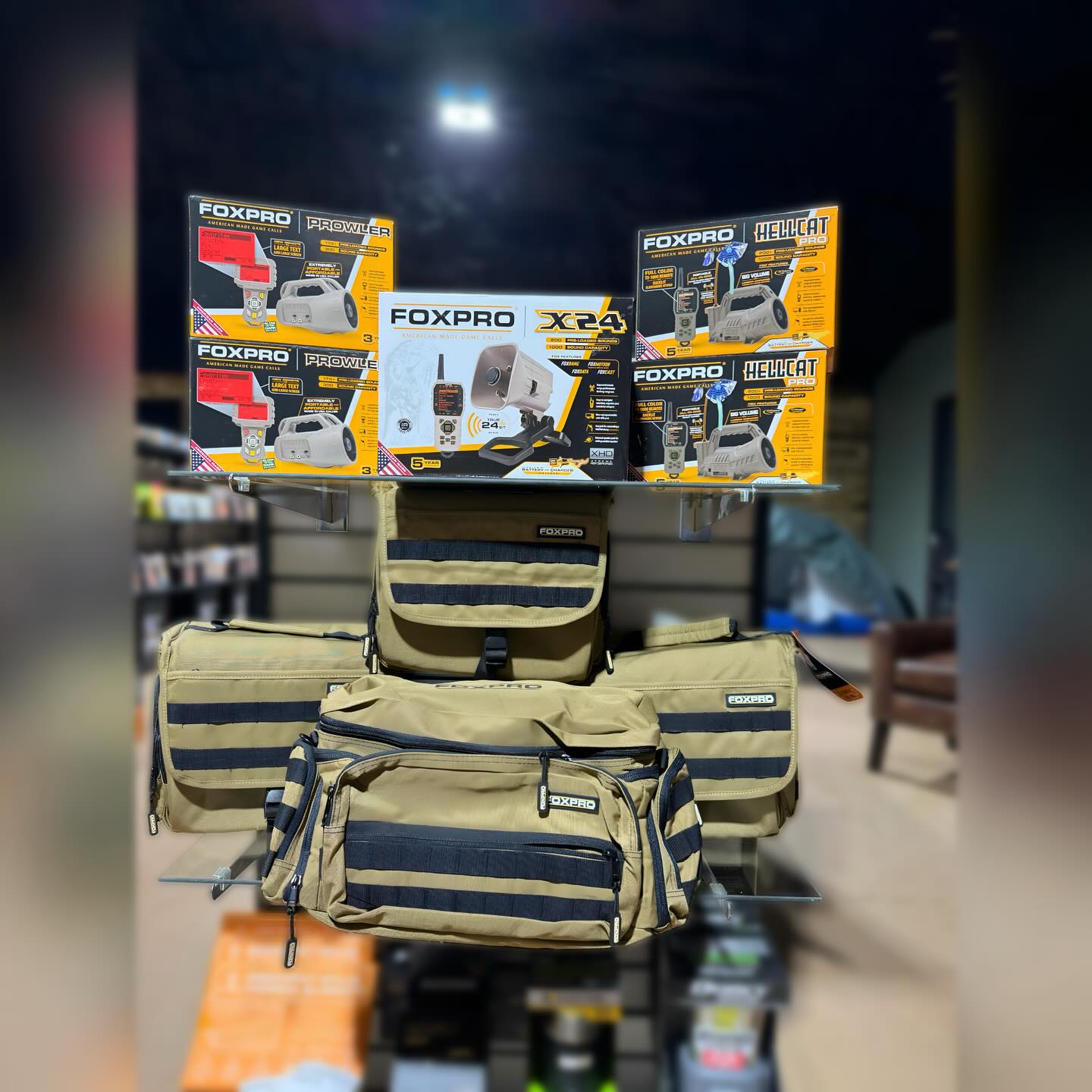 FOXPRO game call products and tactical bags display at The Highland