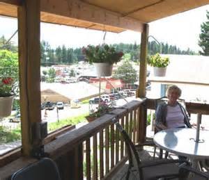 Covered porch at Burro Street Boardinghouse looking out toward downtown Cloudcroft