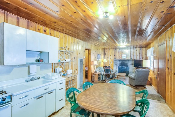 Outdoor view of cabins and surrounding pines at The Cabins at Cloudcroft