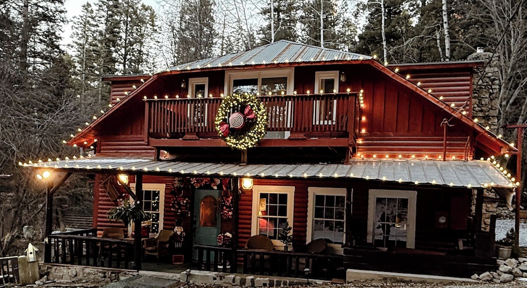 The Crofting Bed and Breakfast exterior with holiday lights in winter