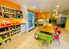 Shared kitchen with warm lighting at Cloudcroft Hostel