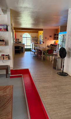 Common area and entry at Cloudcroft Hostel with lounge seating
