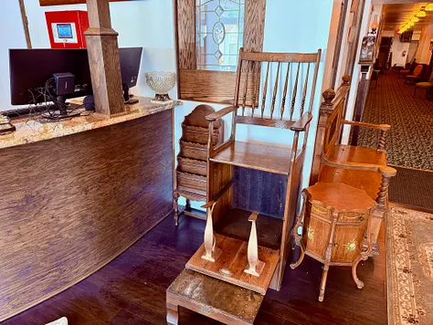 The check-in desk at Hotel Cloudcroft, a wooden bank desk from Lincoln, NM