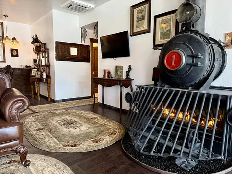 Fireplace built from a locomotive front in a Hotel Cloudcroft sitting room