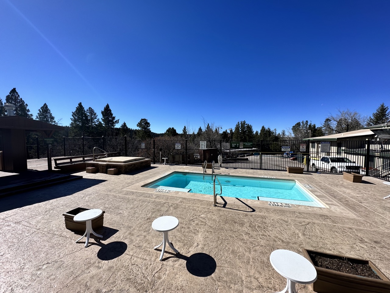 Outdoor pool and hot tub area at The Lodge at Cloudcroft